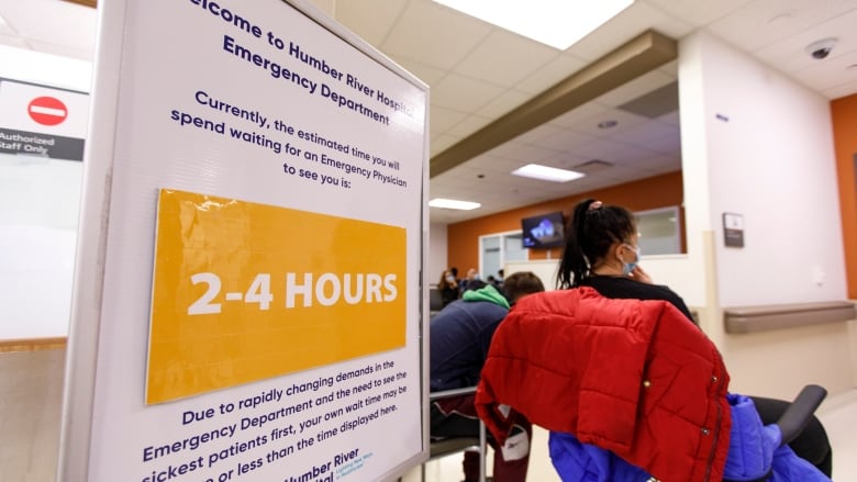 A sign, indicating the estimated wait time at Humber River Hospital, is pictured in the emergency department in Toronto on April 26. The hospital is facing higher patient volumes, and a rise in flu cases.