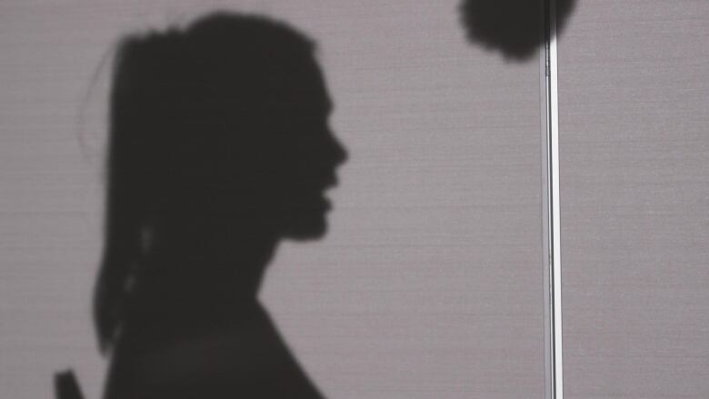 A silhouette of a woman.