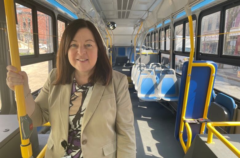 Woman standing in a bus