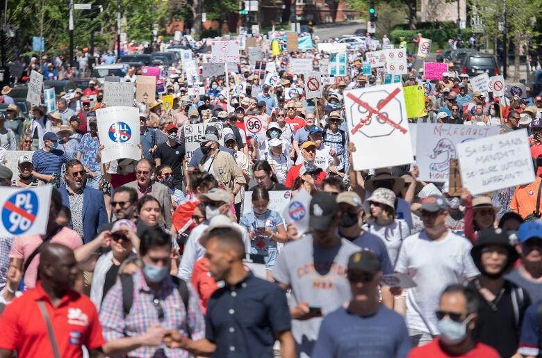 There is a large crowd in the street. 