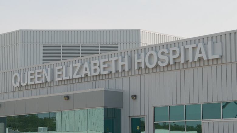 Front of hospital with sign that says Queen Elizabeth Hospital