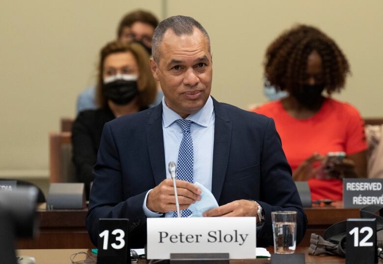 Former Ottawa police chief Peter Sloly sits and waits to appear as a witness at the House of Commons Procedures and House Affairs committee June 2, 2022 in Ottawa.