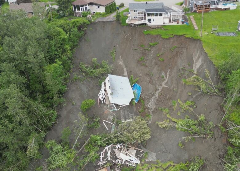 destroyed house on steep hill