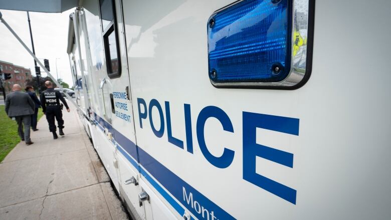 A stock shot of the side of a Montreal police truck.