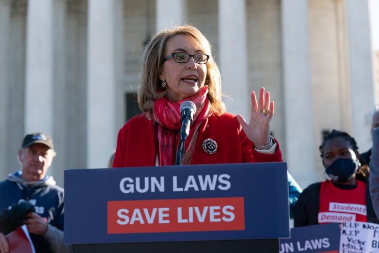 WOman speaking at podium