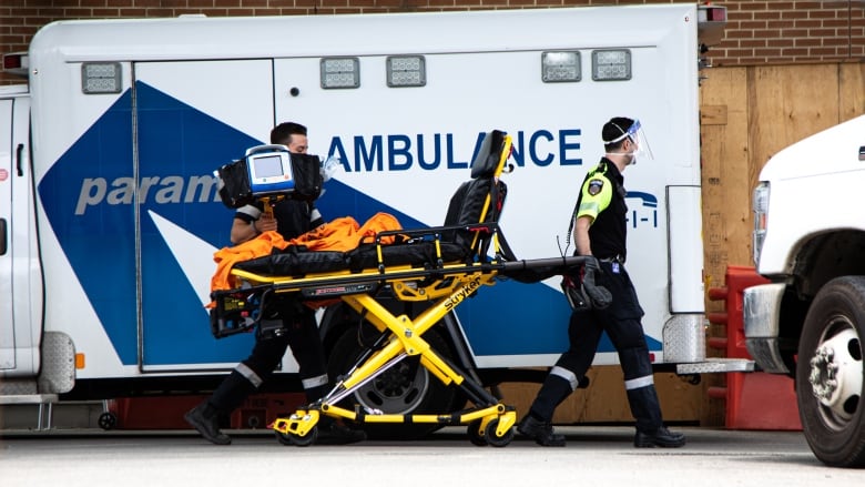 Paramedics are pictured outside the Toronto Western Hospital Emergency Department on Wednesday, June 15, 2022. 