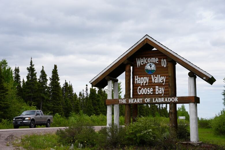 A roadside sign that reads 'Welcome to Happy Valley-Goose Bay. The heart of Labrador'