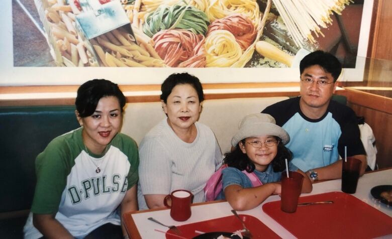 A family at a restaurant table.