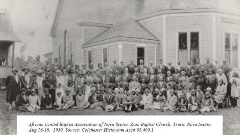 An old black and white image of church congregation's group photo