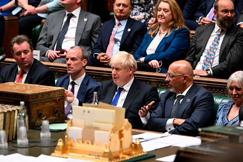 In this photo provided by UK Parliament, Britain's Prime Minister Boris Johnson attends Prime Minister's Questions in the House of Commons in London, Wednesday, July 6, 2022.