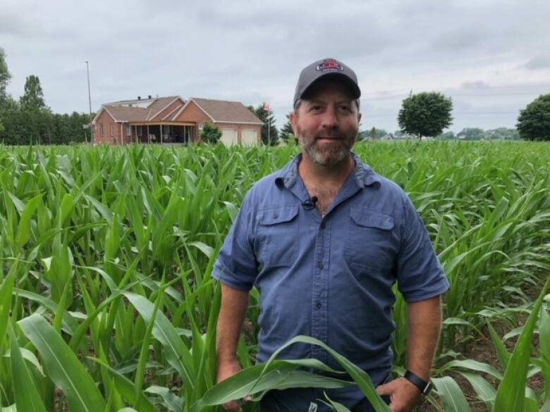 Man standing in the middle of a field.