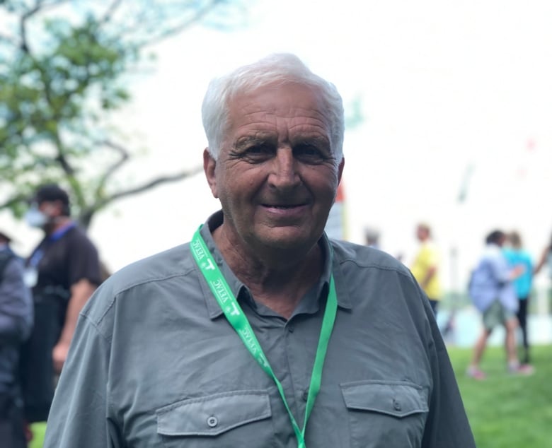 Man wearing a green lanyard.