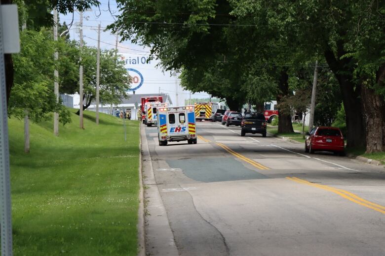 Emergency vehicles are seen on a road leading to the Imperial Oil terminal in Sydney, N.S.