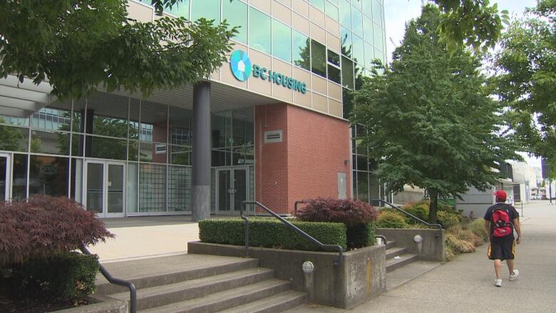 A person walks past the B.C. Housing offices on Terminal Avenue in Vancouver on Saturday, July 9, 2022.