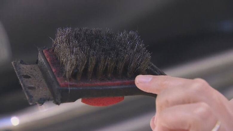 A metal bristle barbecue brush.