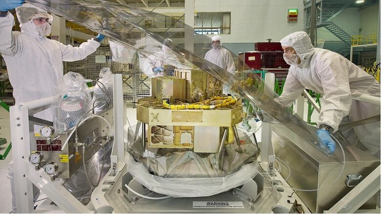 Scientists working on the Fine Guidance Sensor (FGS) and the Near-Infrared Imager and Slitless Spectrograph (NIRISS)  two instruments aboard the James Webb Space Telescope  at NASA's Goddard Space Flight Center. 