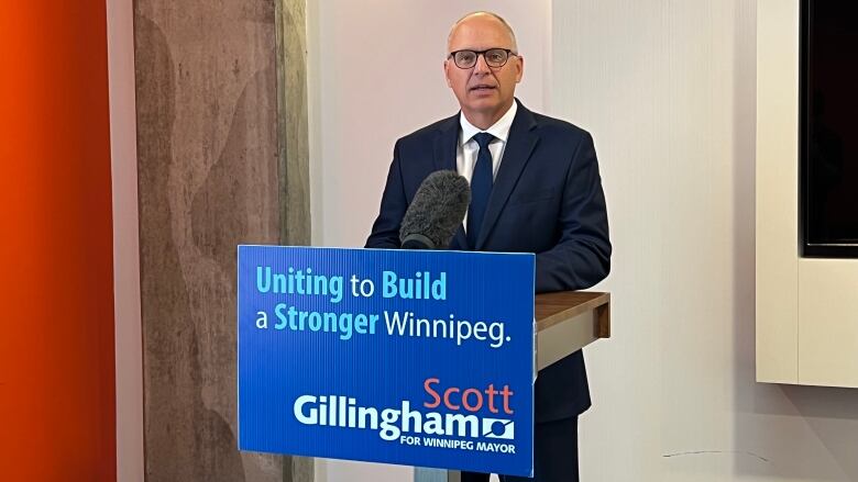 Man standing behind a podium.