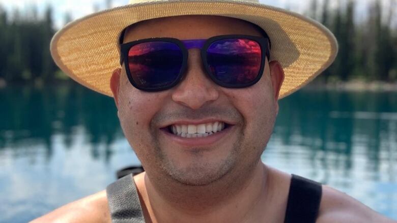 Benjamin Sotelo, the victim of a parking lot roof collapse last Thursday in Vancouver, is seen in an undated photograph wearing a hat, sunglasses, and smiling.