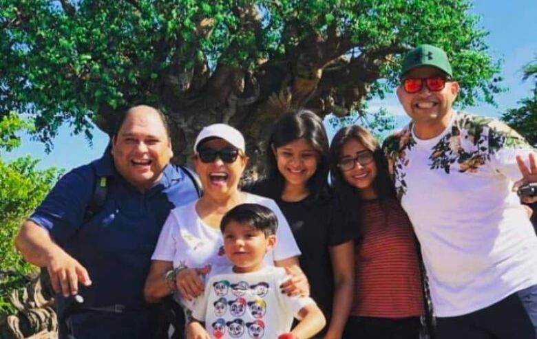 Benjamin Sotelo (right), the victim of a parking lot roof collapse last Thursday in Vancouver, is seen with his family in an undated photograph.