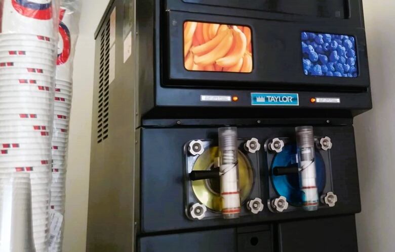 A machine with different flavoured ice drinks.