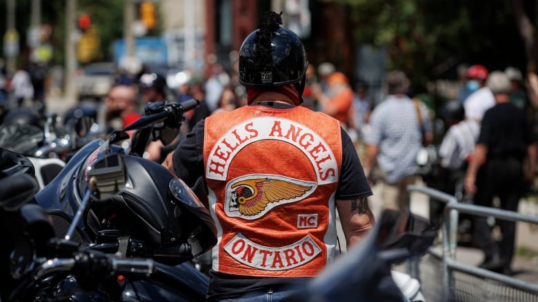 man wears biker vest that says hells angels