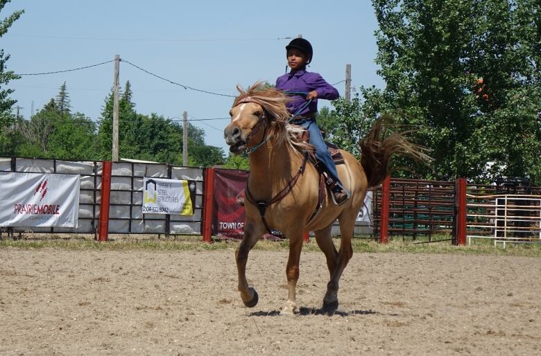 A person rides a horse.