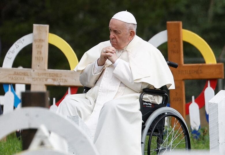 A man sits in a wheelchair.