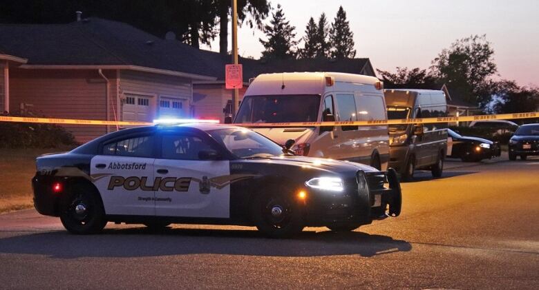 Abbotsford police block off the road outside the home where Kamaljit Sandhu was killed on July 28, 2022.