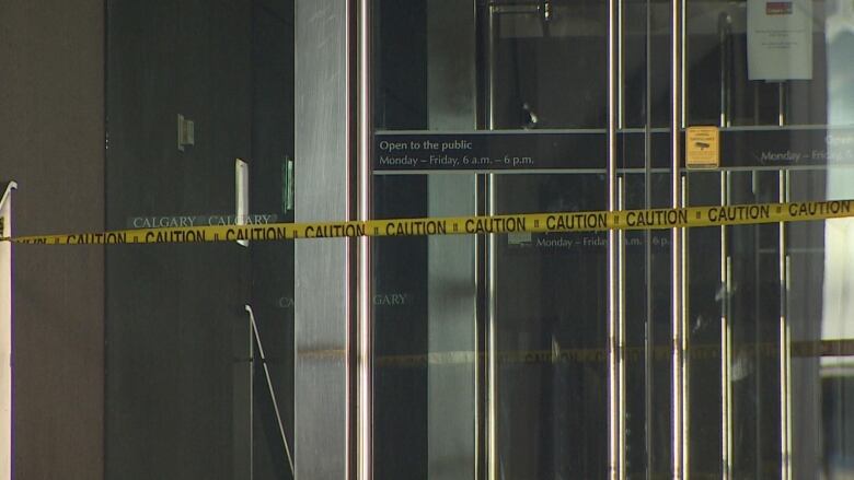 Caution tape blocks off a door to the municipal building. 