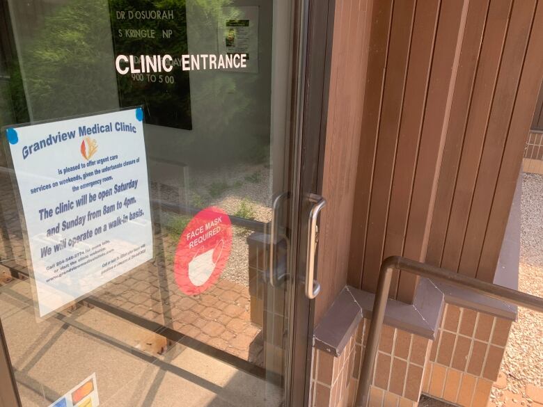 Sign on the entrance to the clinic in Grandview indicates it will be open on Saturdays and Sundays from 8 a.m. until 4 p.m.