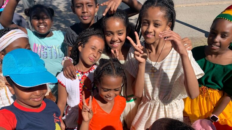 A crowd of smiling children. 