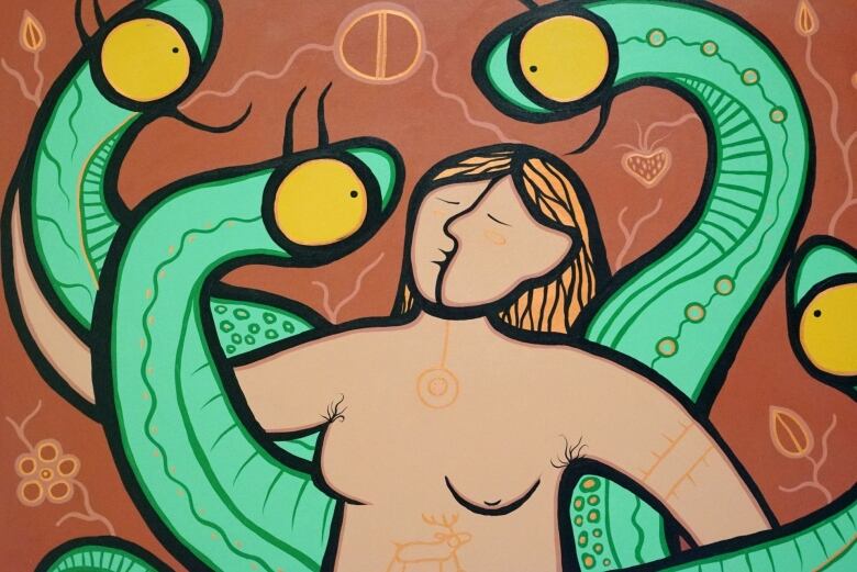 A painting created by an Indigenous artist shows a woman with tribal tattoos surrounded by snakes.