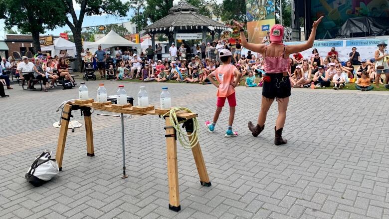 Crowds gather for 'The Farmer's Daughter Show', one of the outdoor offerings at this year's Fringe Festival.