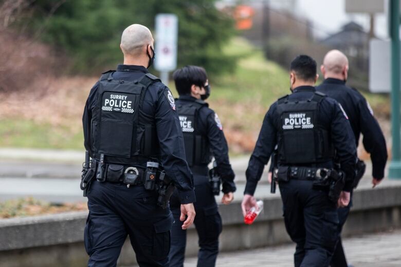 4 Surrey Police Service officers 