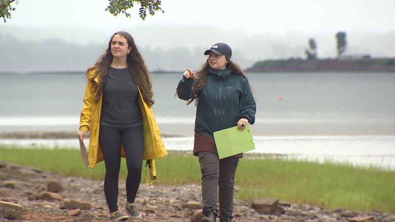 Erin Nelson and Emma Doucette at Queen Elizabeth Park with the sea in the background.