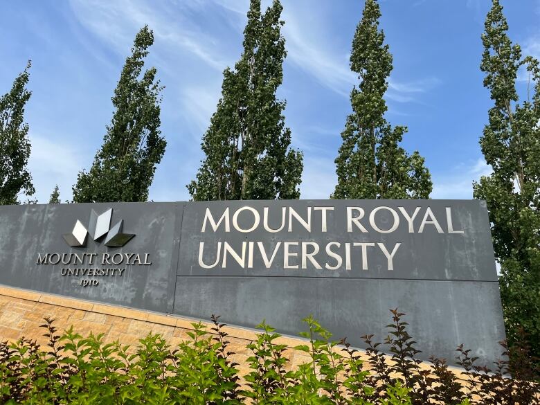 A sign with the university's name stands outside Mount Royal University in Calgary.