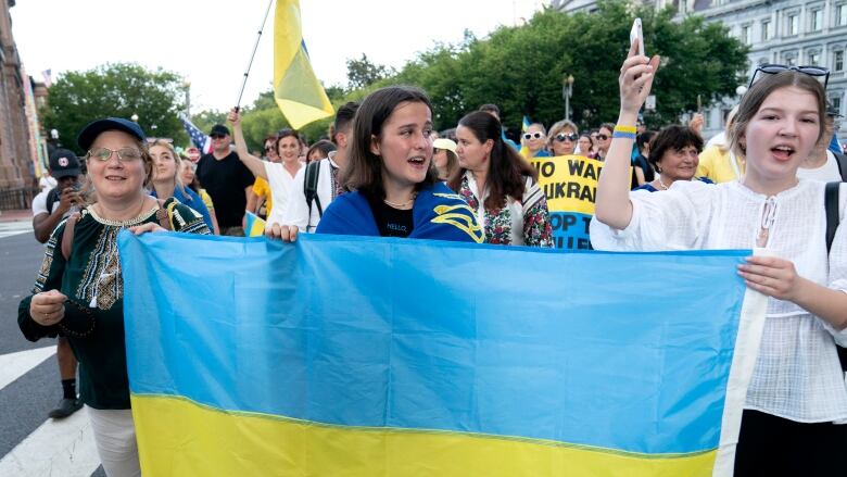 Protesters march near the White House to support Ukraine.