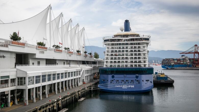 Cruise ship passengers are pictured aboard the Celebrity Eclipse while it is delayed leaving from port due to a tugboat strike in Vancouver, British Columbia on Monday, August 29, 2022. 