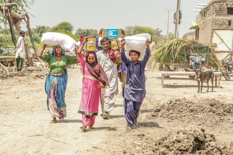 women and girls walking with bags