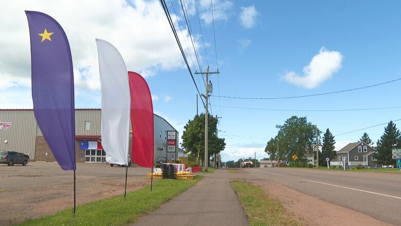 Banners showing the colours of the Acadian flag.