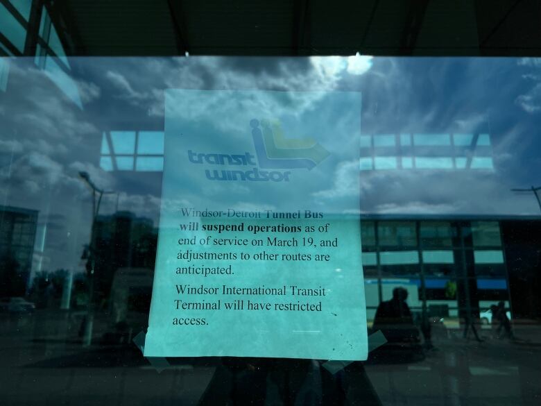 Sign hangs in window at Transit Windsor.