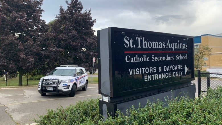 police car in front of St. Thomas Aquinas Catholic Secondary SChool in London ontario 