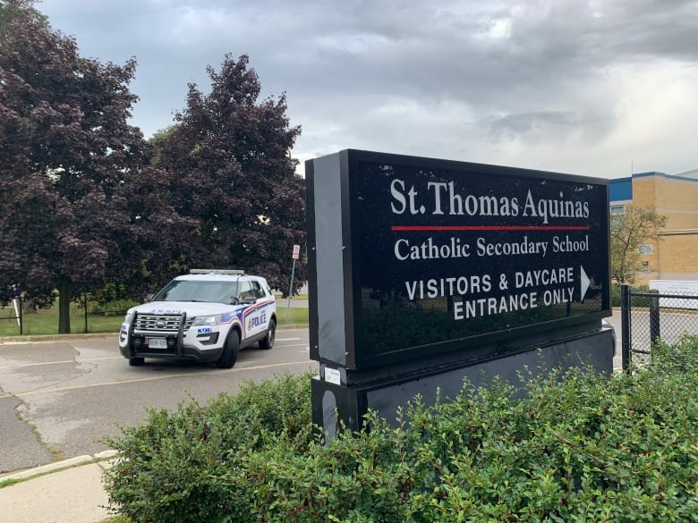 police car in front of St. Thomas Aquinas Catholic Secondary SChool in London ontario 