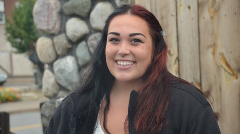 A young woman smiles for the camera 