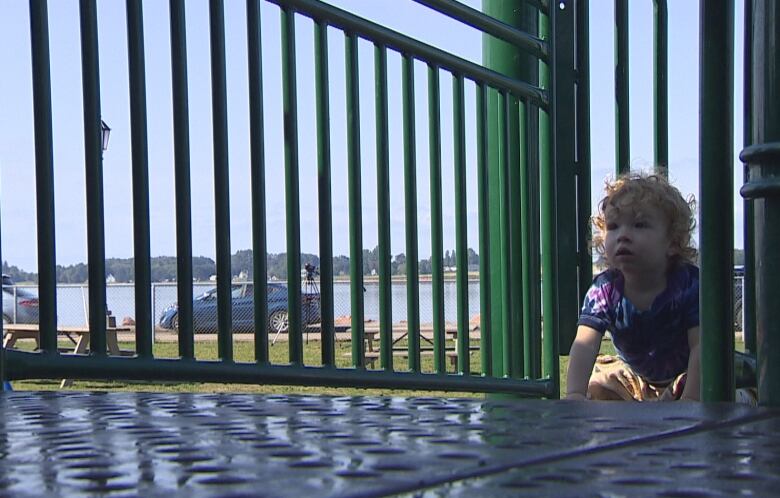 Toddler playing in Victoria Park. 