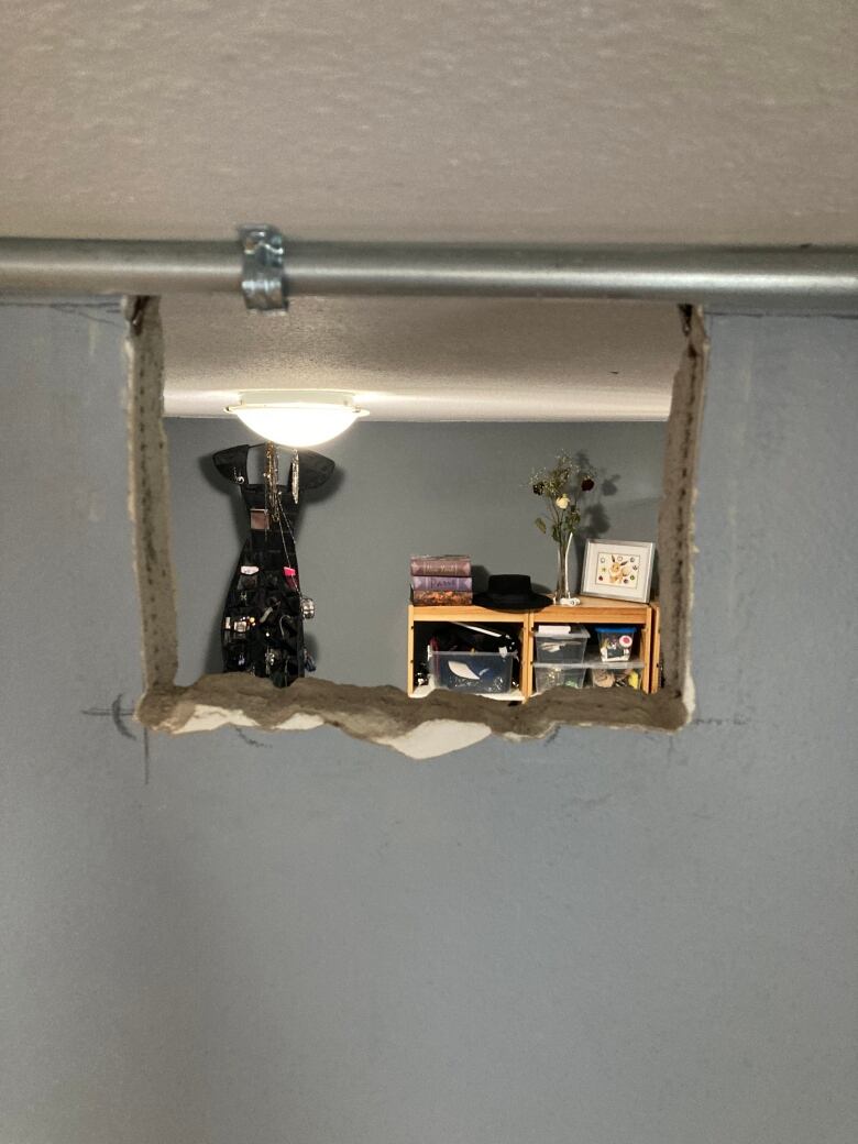 A hole in the wall opens to another room in one of the units at 240 Markland Drive.