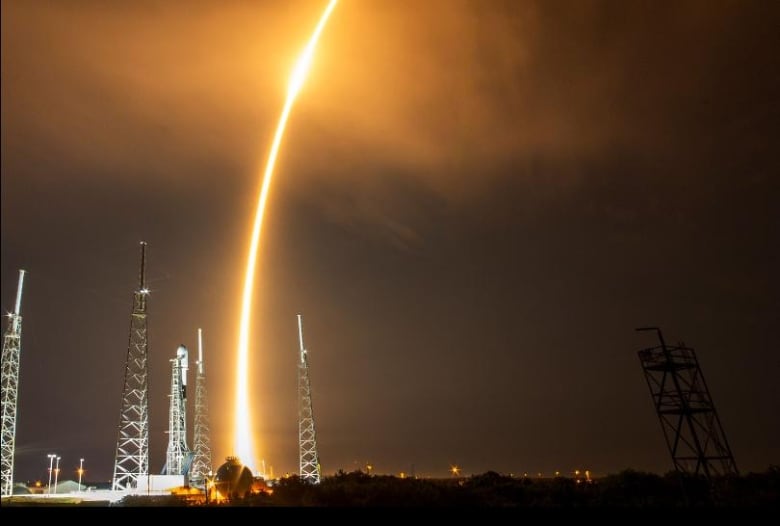 A golden jet rises from a launchpad.