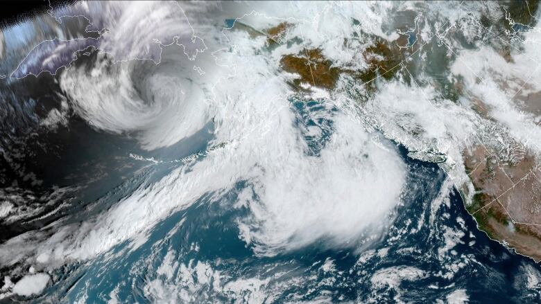 A large storm is seen from orbit approaching Alaska.