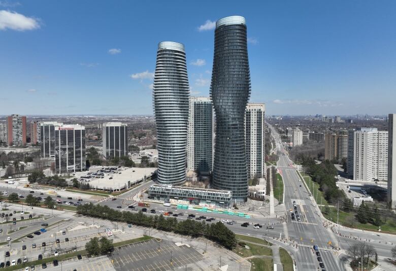 A view of Mississauga City Hall, Celebration Square Clock Tower, Square One,Absolute Condos, known asthe 'Marilyn Monroe Buildings,'and surroundingresidential neighbourhoods.