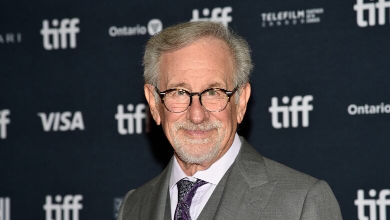 man in front of TIFF signage